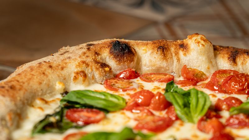 Classic Margherita crust pizza with fresh basil