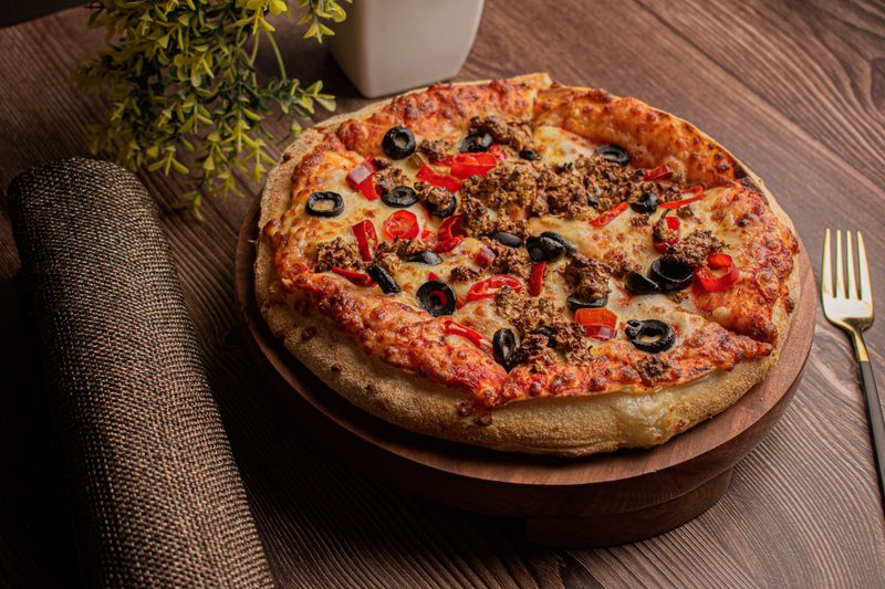 Wagyu beef gourmet pizza on artisan crust