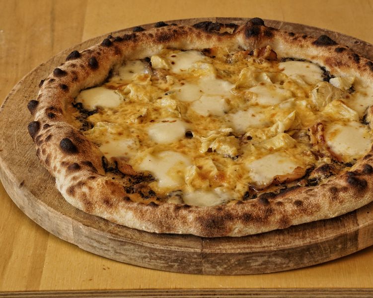 Pumpkin and goat cheese vegetarian pizza on rustic crust