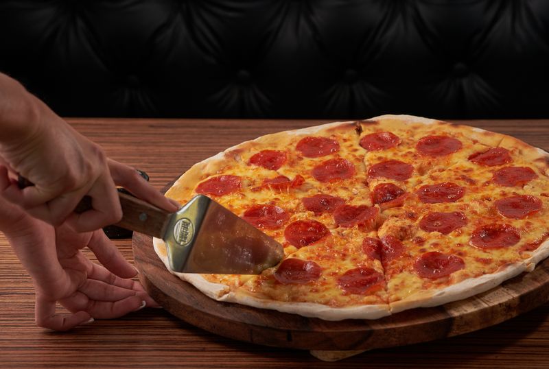 Spicy arrabbiata vegetarian pizza with chilli on crispy crust