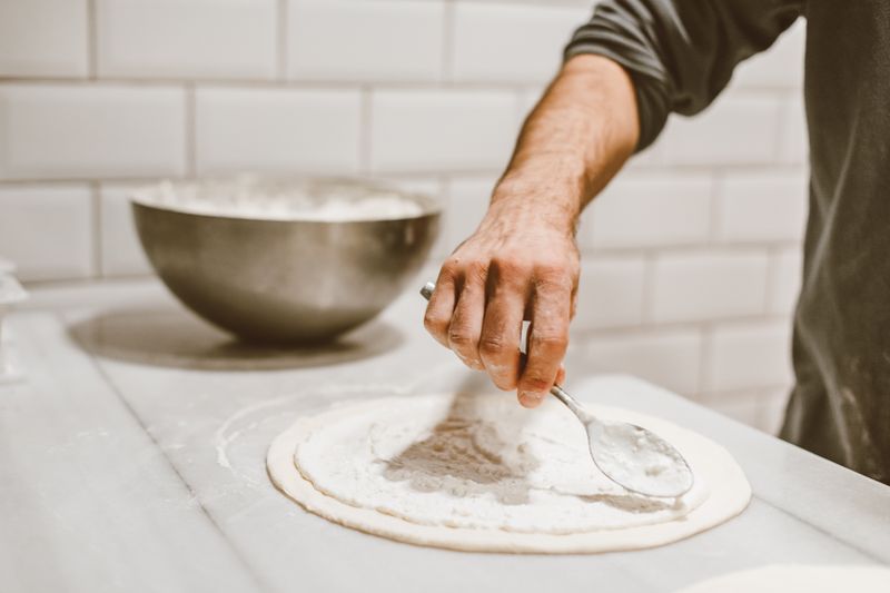 Crust kitchen — handcrafted crust pizza being prepared fresh
